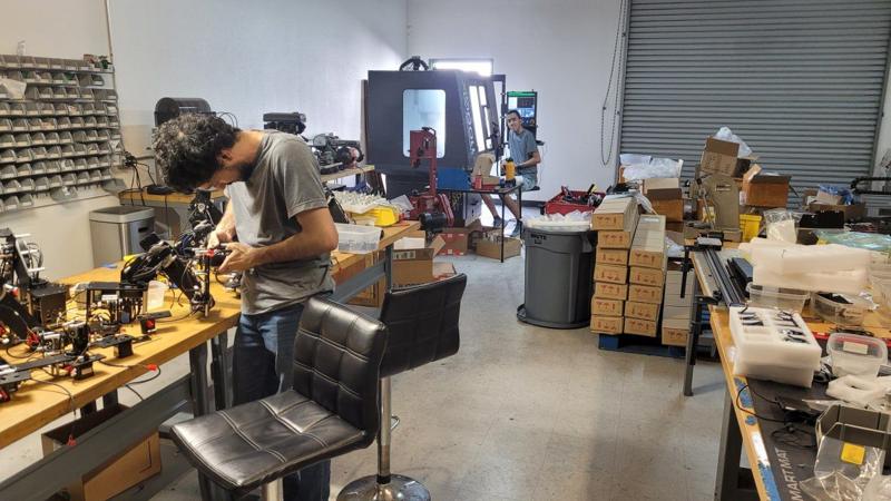 Me on the CNC, robots being assembled